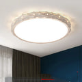 Round iron LED ceiling lamp with a black frame and dimmable light, mounted on a white ceiling.