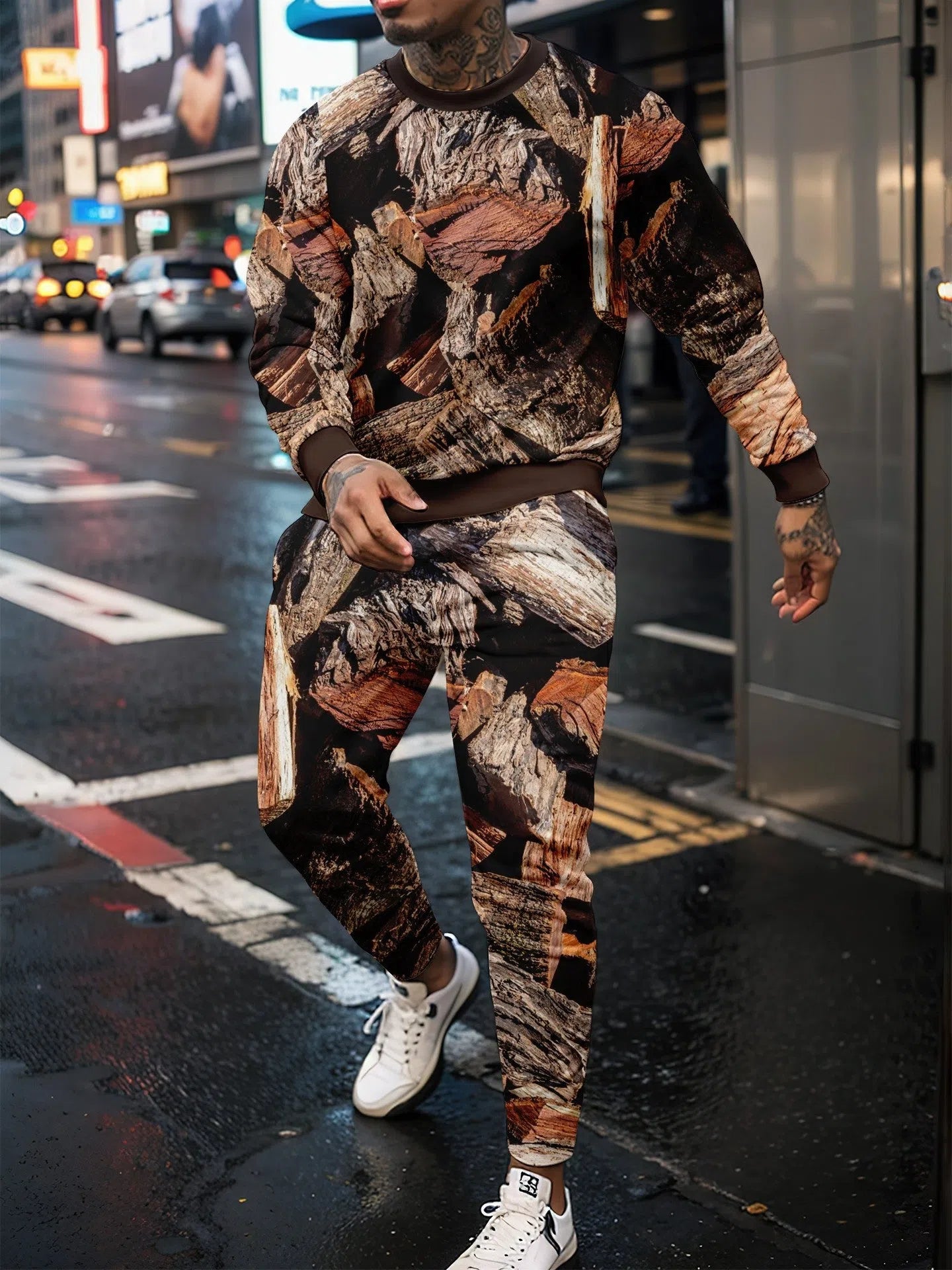 Two-piece jungle camouflage sportswear set with long-sleeve round neck top and matching trousers on a male model