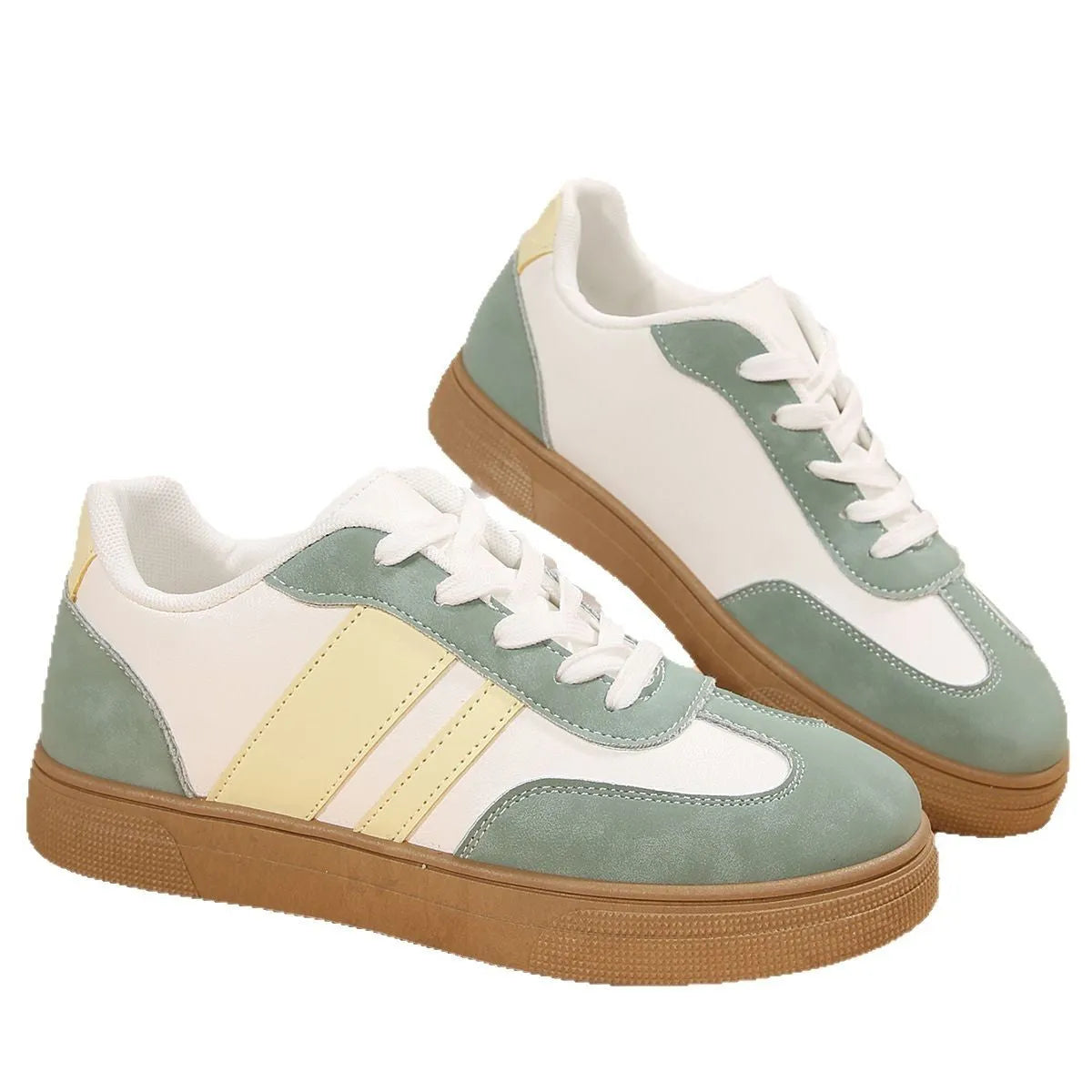 Green retro women's low-top pumps with cross straps, round toe, and flat rubber sole on a white background.
