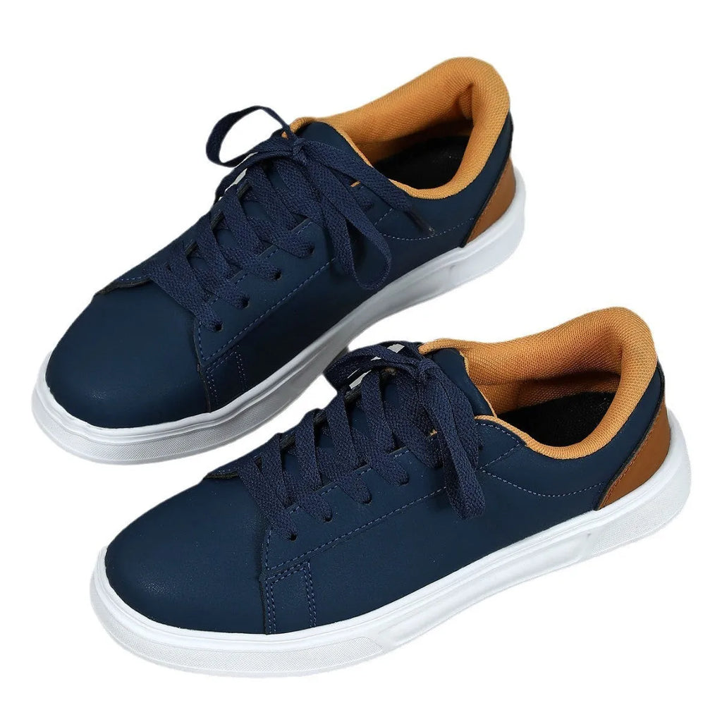 Beige brown platform casual skateboard sneaker with round toe and cross-strap detail on a white background.