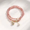 Strawberry quartz crystal bracelet with geometric pink beads on adjustable string