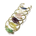 Geometric gold wire bracelet with unshaped natural rough stone crystals in bohemian style.