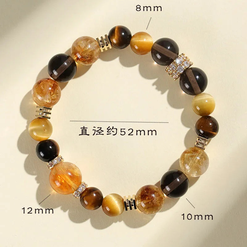 Yellow artificial crystal bracelet with 10mm Jinba large beads on a string.