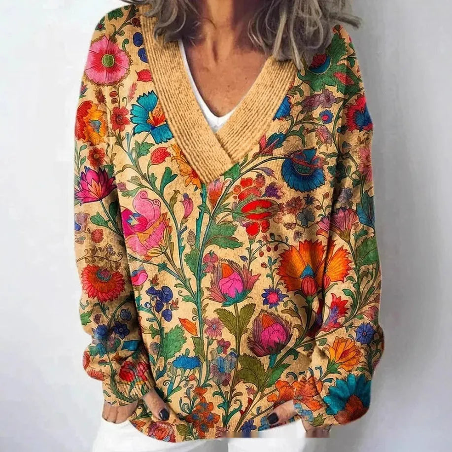 Women's grey V-neck sweatshirt with a white 3D floral pattern print and long sleeves.