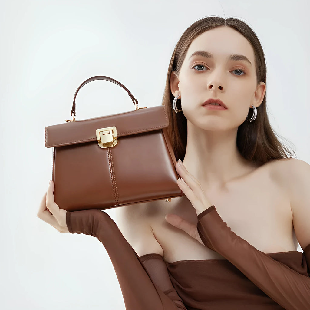 Genuine leather women's shoulder bag with clasp closure showing interior hidden compartment