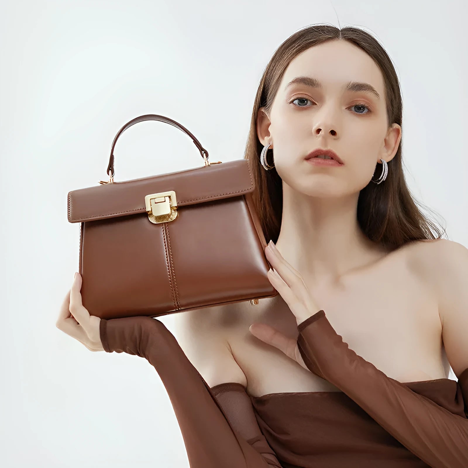 Genuine leather women's shoulder bag with clasp closure showing interior hidden compartment