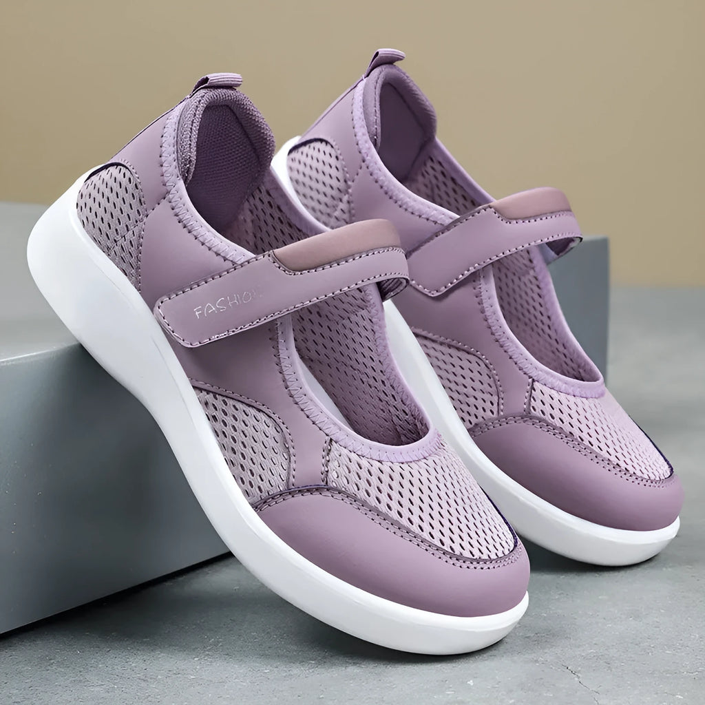Women's low-top cloth shoes with mesh upper and Velcro strap in grey.