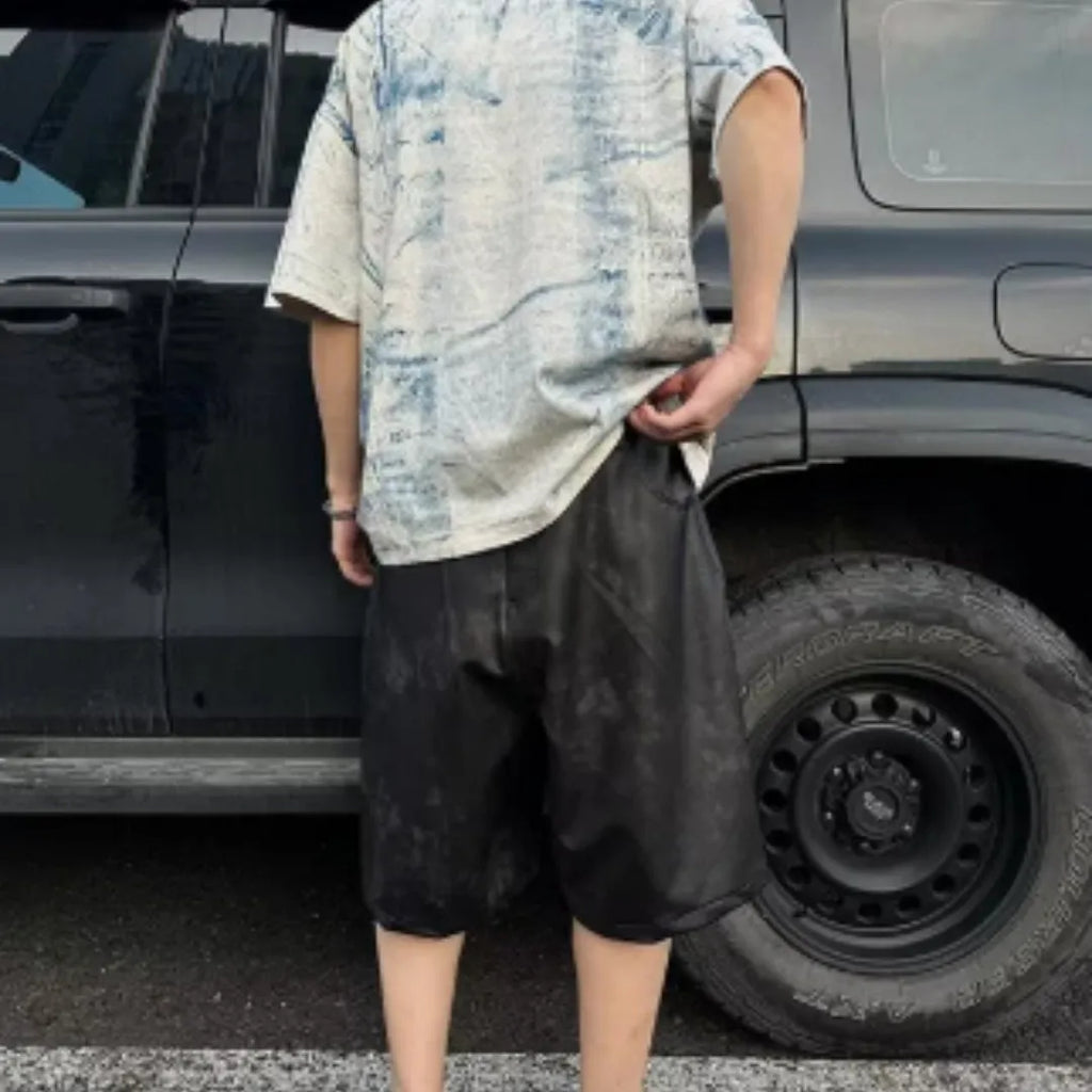 Korean style loose fit tie-dye printed t-shirt on a solid colour background.