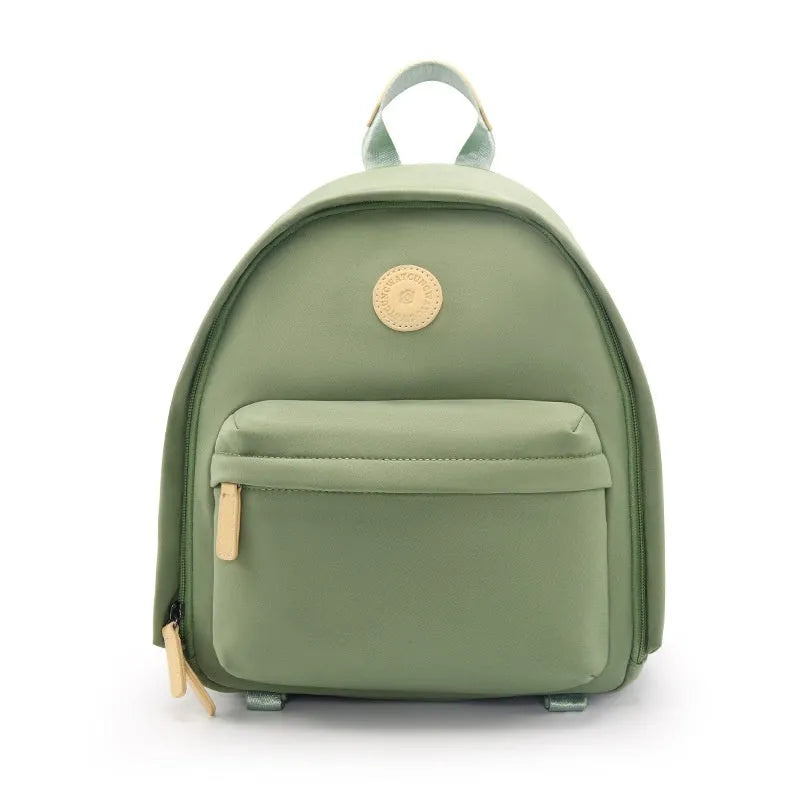 Green polyester shoulder camera bag for women with a detachable iPad compartment on a curve belt.