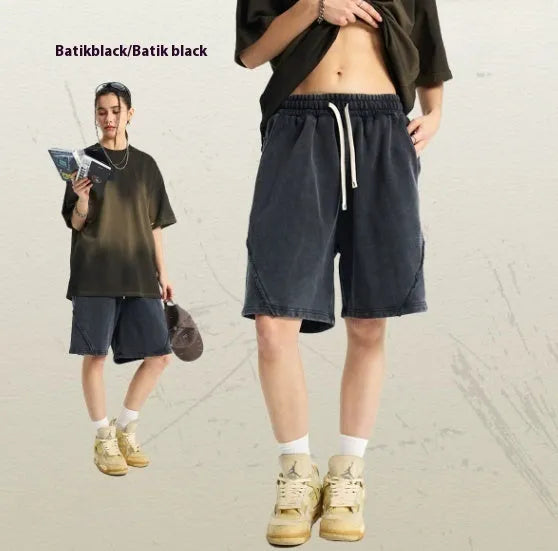 Men's loose-fit batik washed shorts in cotton terry fabric, showing patch craft details and available colour options.