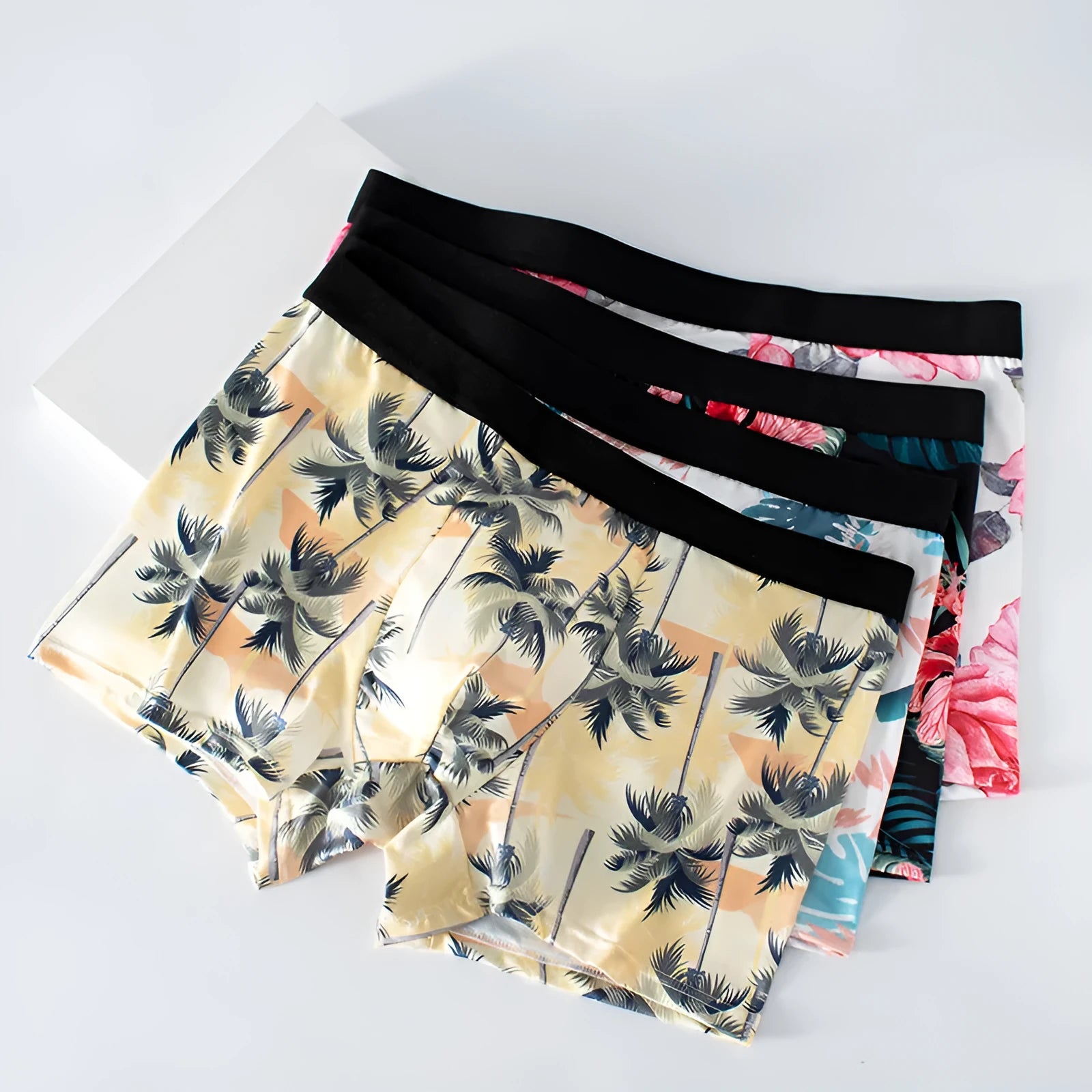 Ice silk men's boxer shorts with floral print, showing mid waist fit and breathable polyester fabric.