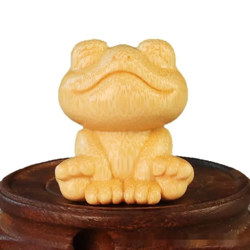Solid bamboo carving ornament with smiling frog design measuring 5cm tall