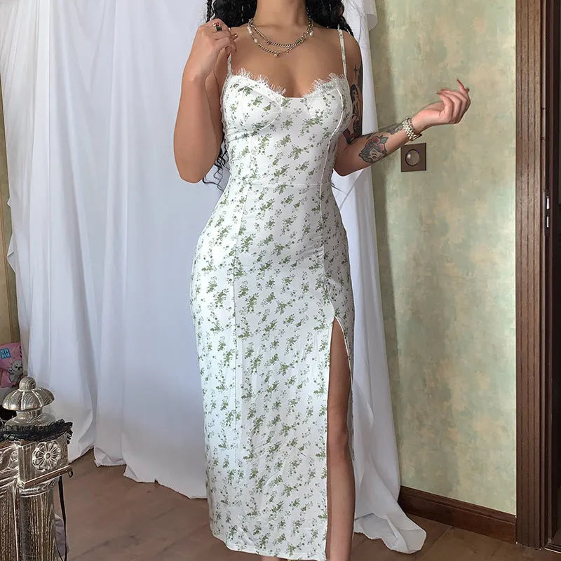 Women's blue lace print long dress with suspender straps and a thigh-high side slit.