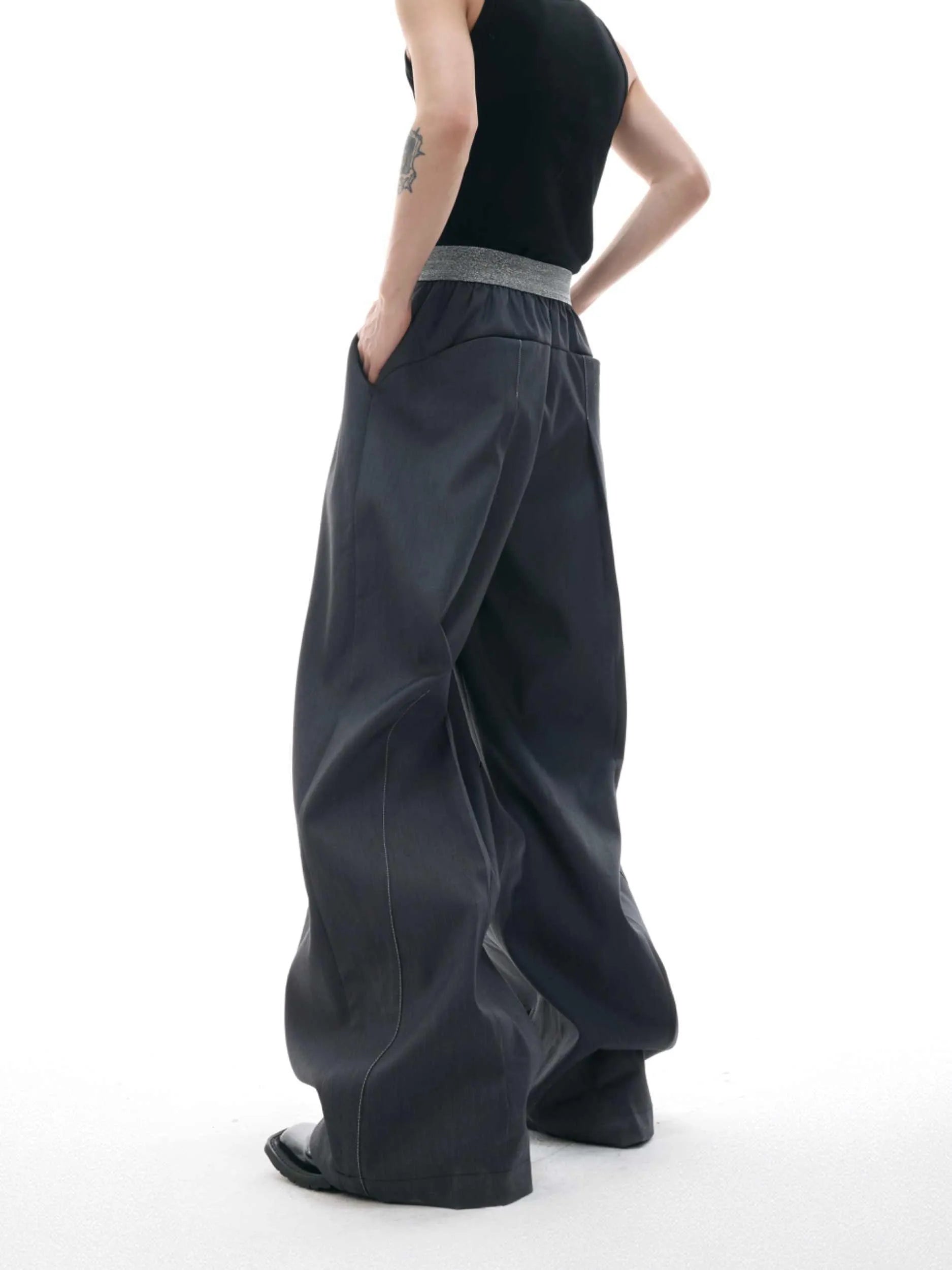 Drooping straight-leg suit pants in black with button open line design and high-waisted fit