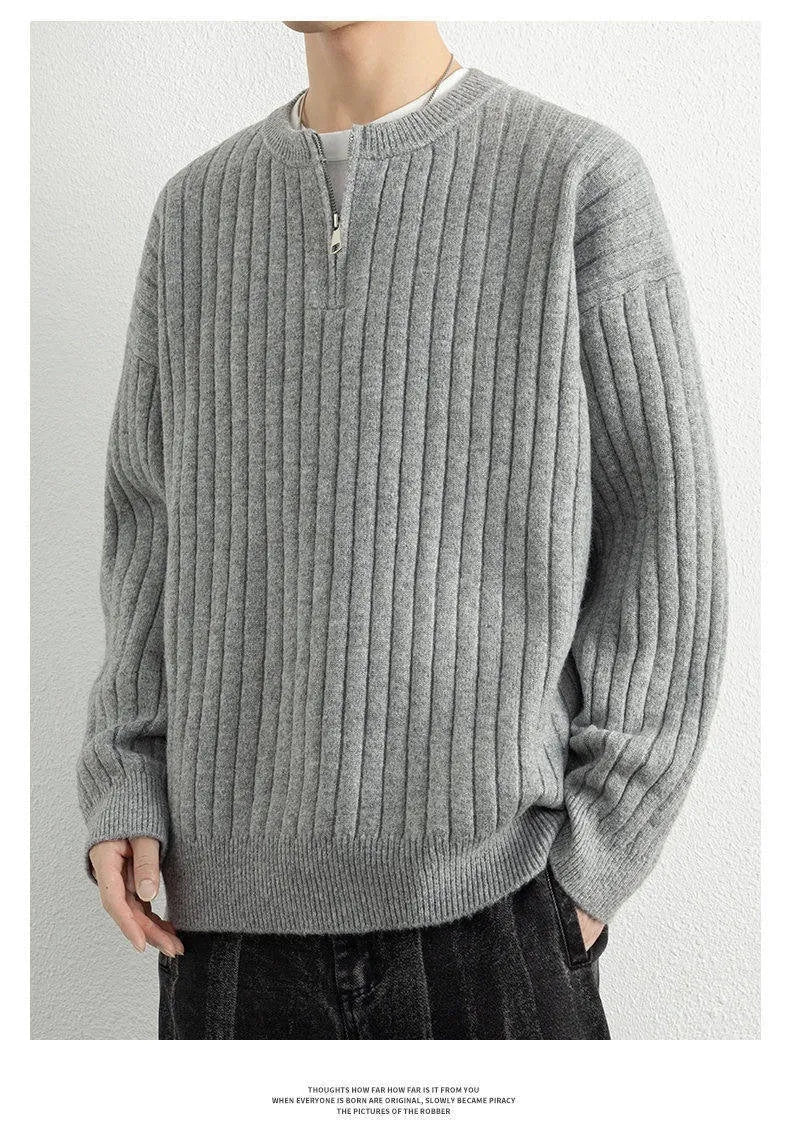 Men's grey half zip textured knit sweater showing loose fit design and adjustable zip closure