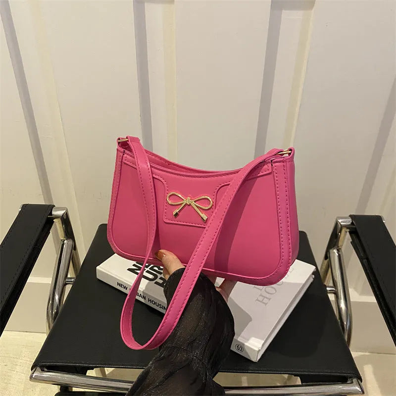 Western style baguette shoulder bag in six colours with 24x14x5cm dimensions and single strap