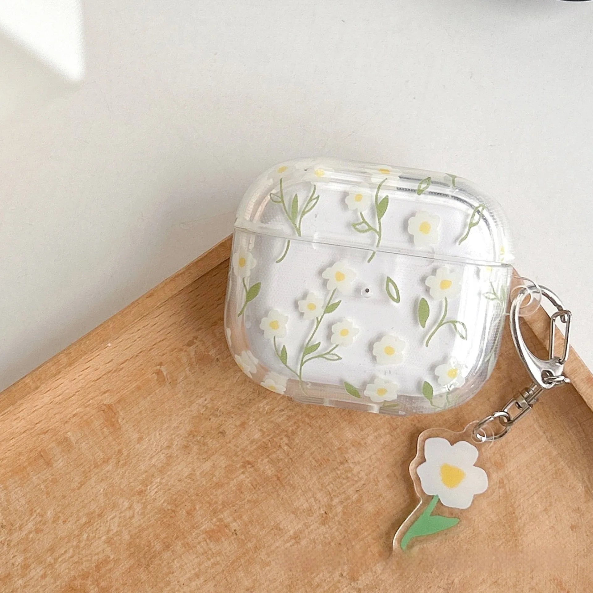 White floral pattern on a transparent TPU protective case for Apple AirPods