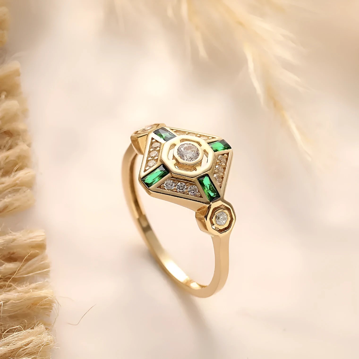 Square-shaped green emerald diamond fashion ring in ins style on a plain background.