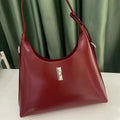 Soft genuine leather crossbody shoulder bag in dumpling shape with internal phone pocket and change compartment