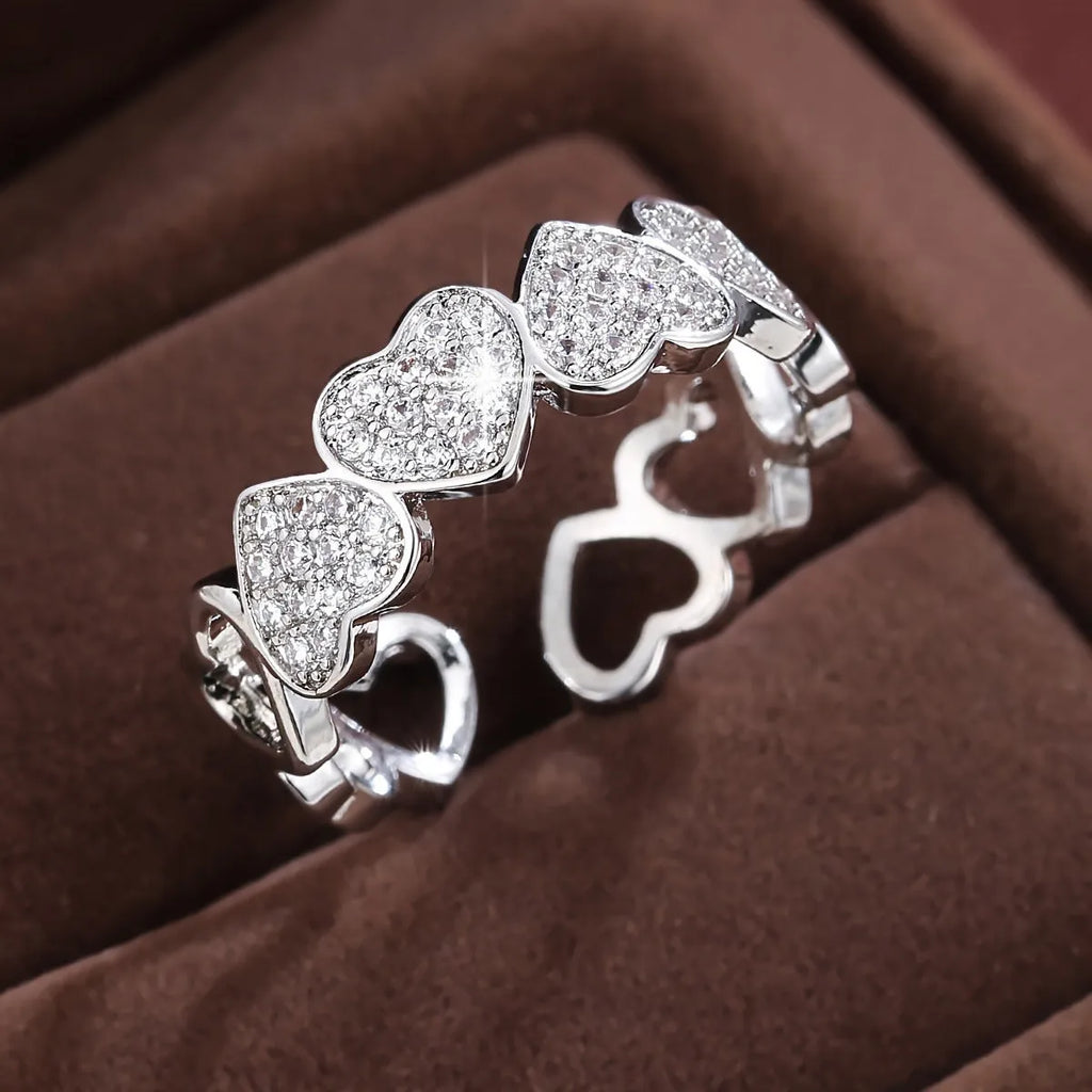 Adjustable opening geometric couple's ring with love/heart design in gold or silver colour