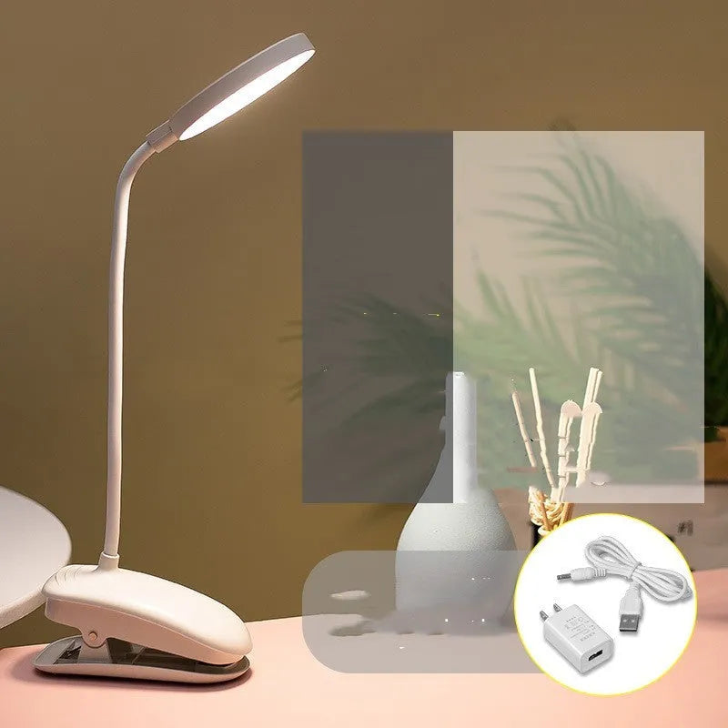 LED clip-on desk lamp with touch dimming, plastic shade, available in white, pink, or green.
