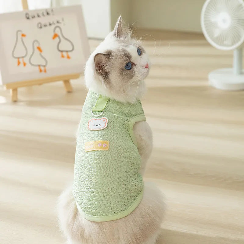 Green cat clothes with hollowed-out bear patch design made from knitted fabric