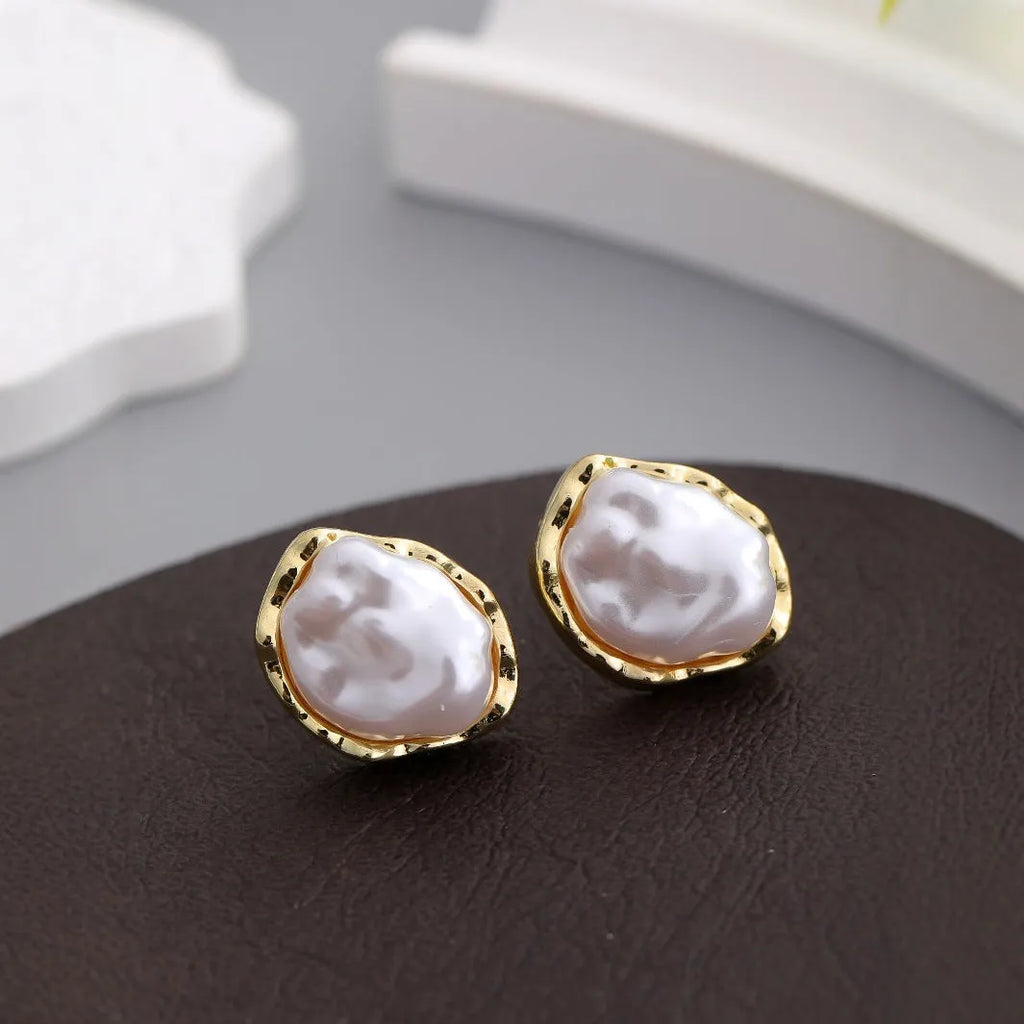 Irregular freshwater pearl drop earrings with gold-toned alloy metal findings in white and gold
