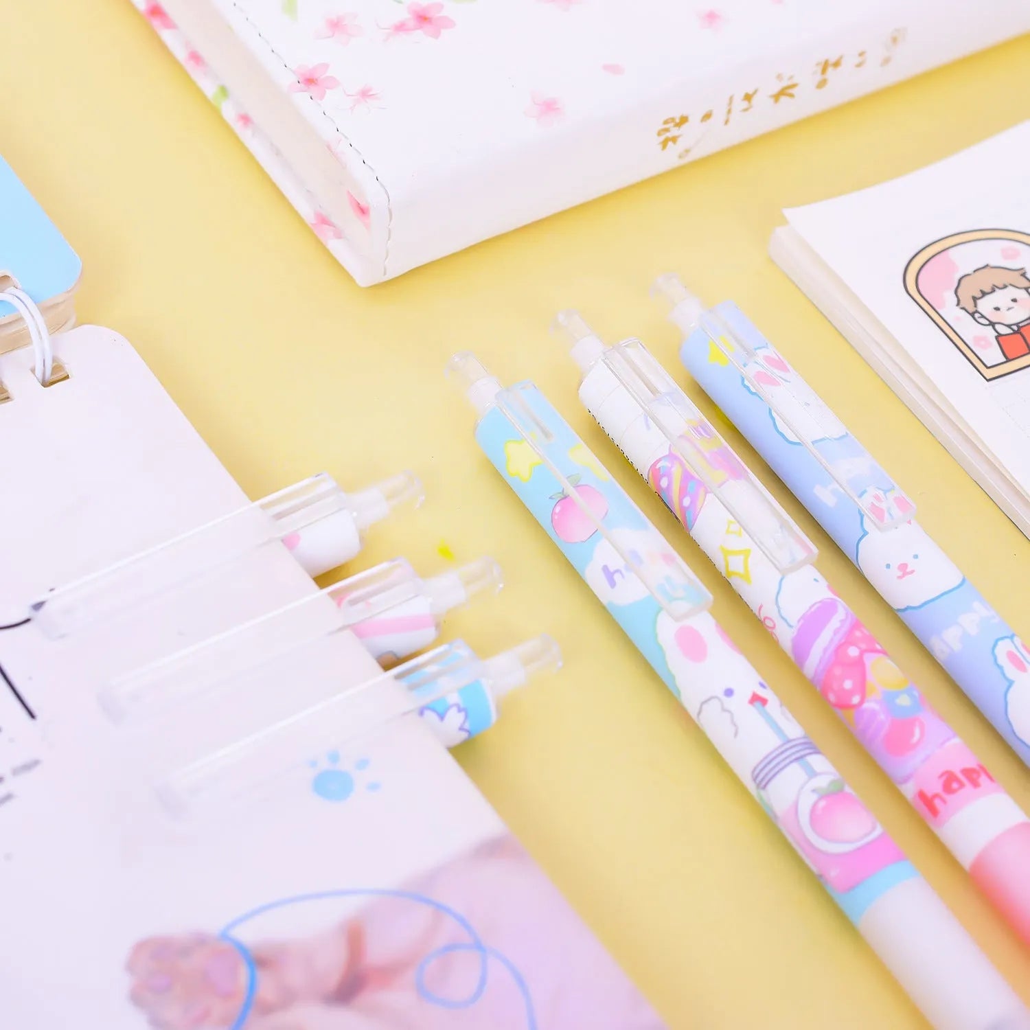 Six plastic ballpoint pens with cartoon bunny design showing 0.5mm tips and neutral black ink