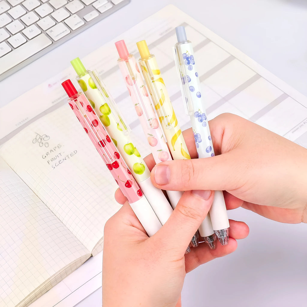 Three fruit scented pressurised pens with 0.5mm black ink and press-action mechanism