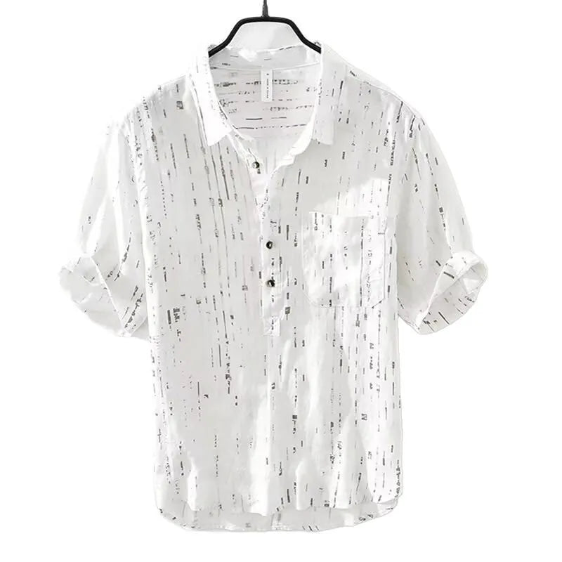 Men's black loose-fit short-sleeved polo shirt with a lapel collar on a hanger.
