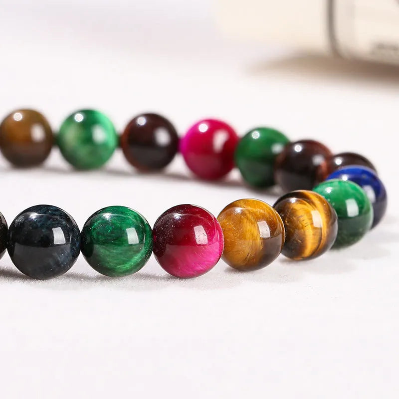 Colourful tiger eye bracelet with natural gemstone beads in multiple sizes on mixed string