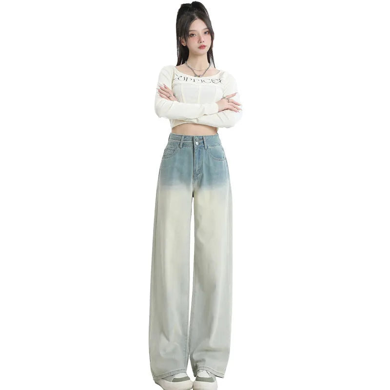 Women's gradient blue straight-leg jeans showing colour transition from lighter to darker blue tones