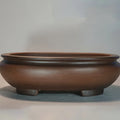 Handmade classical purple sand indoor desktop flowerpot, 58cm tall, on wooden surface.