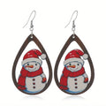 Wooden geometric earrings with printed Christmas tree and snowman Santa Claus designs.
