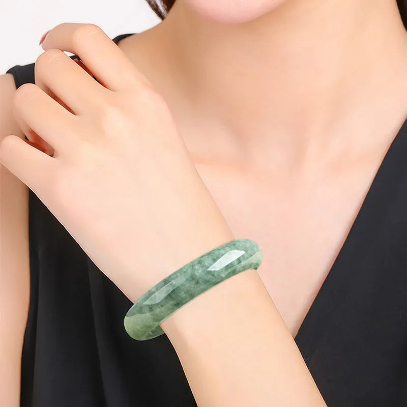 Natural emerald bean green beaded bracelet for women on a gift box.