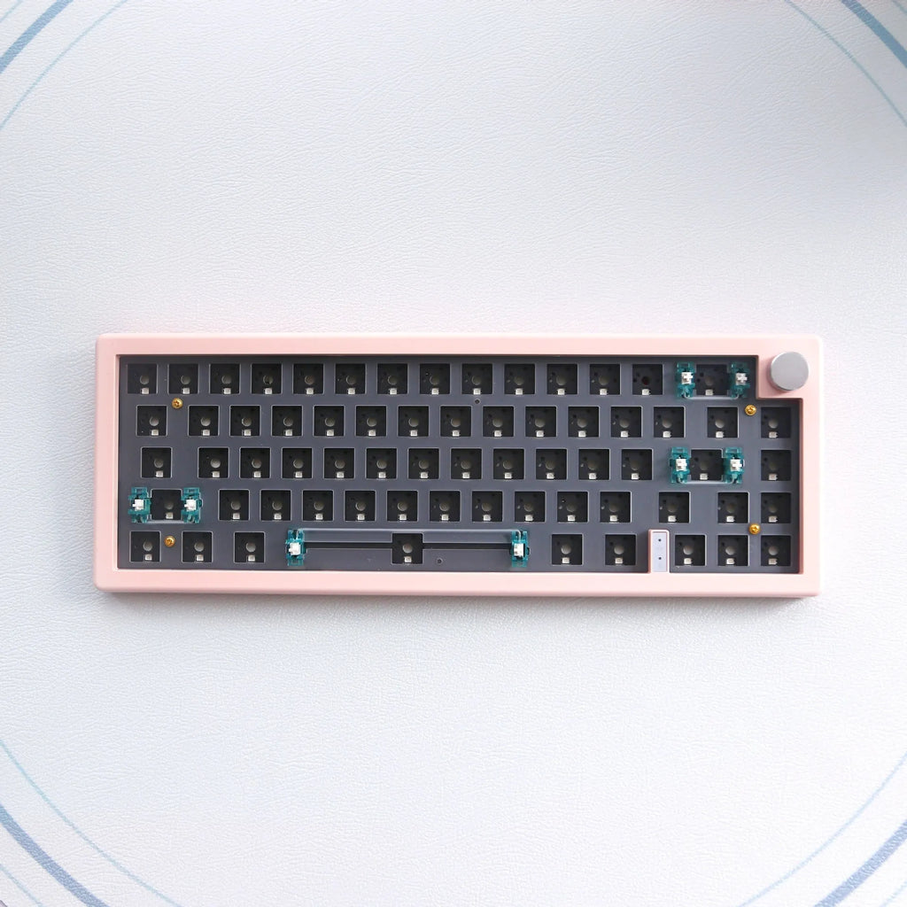 DIY mechanical keyboard kit with RGB lighting in seven colour options showing hot-swap sockets