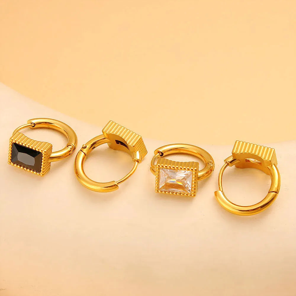 Square geometric zircon earrings with round ring details on stainless steel.