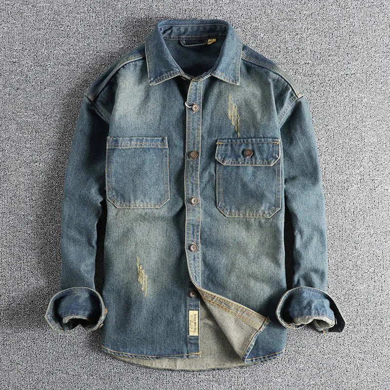 Man wearing a light blue loose-fit vintage denim shirt with long sleeves, cardigan style.