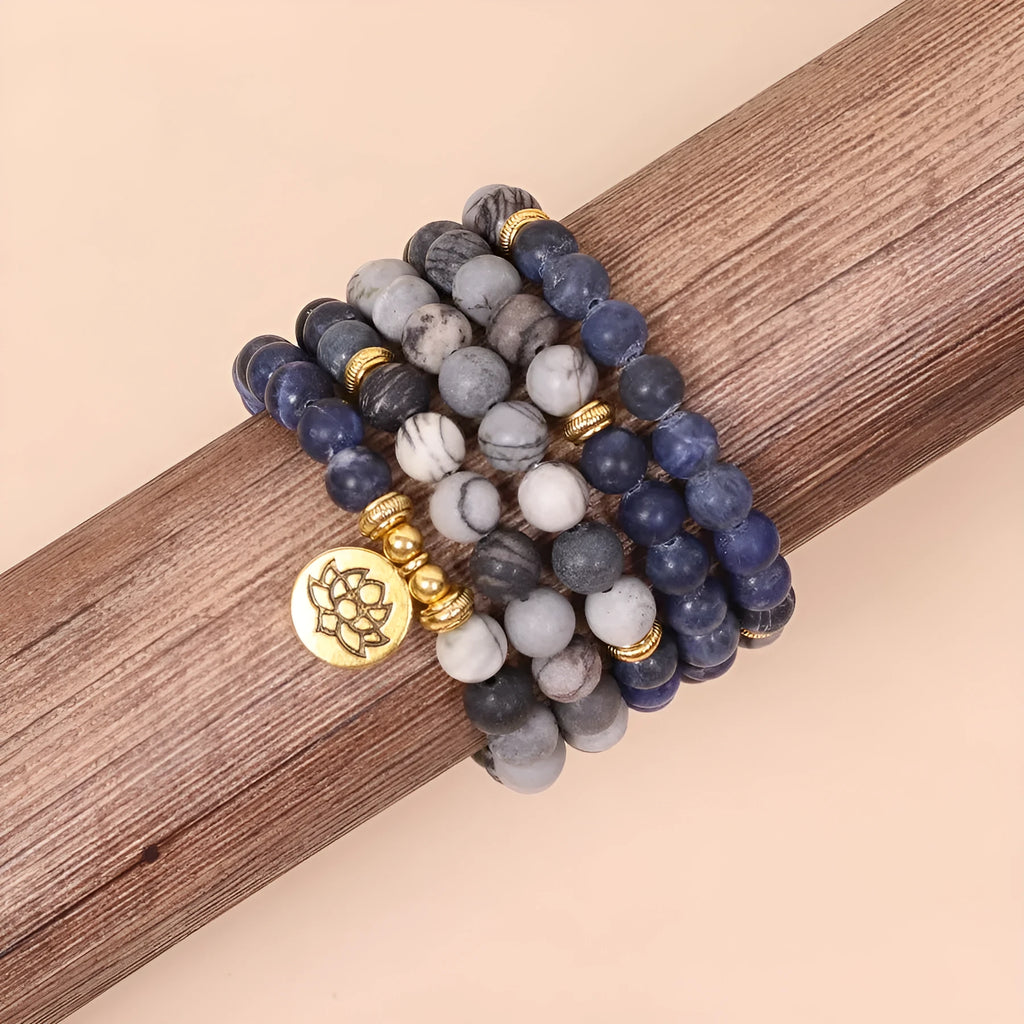 Blue multi layer bracelet with patterned network stone beads and alloy construction