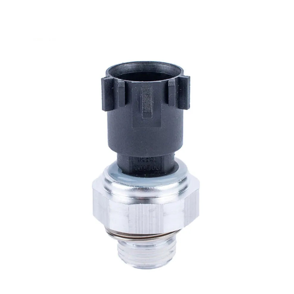 Silver automobile fuel pressure sensor with single port on a white background.