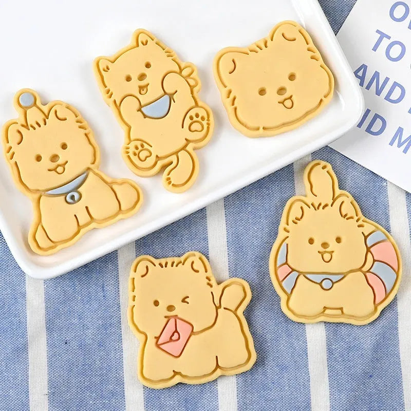 Three-dimensional plastic biscuit mould for making puppy-themed cookies with seven dog cartoon designs