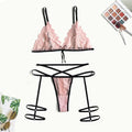 Pink lace hollow three-point lingerie set with leg straps on a model