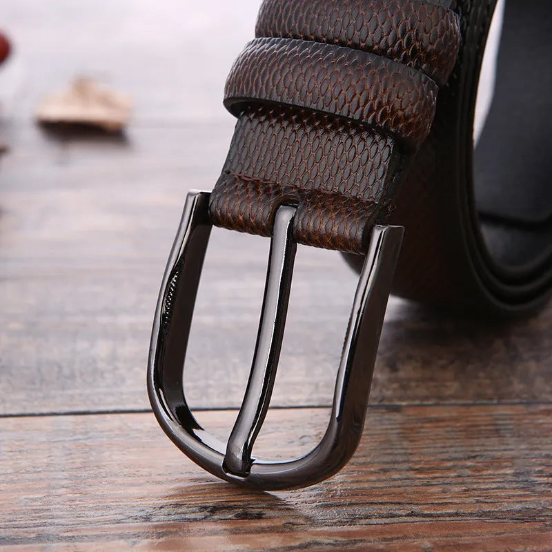 Men's business belt with electroplated alloy buckle showing laser logo pattern detail