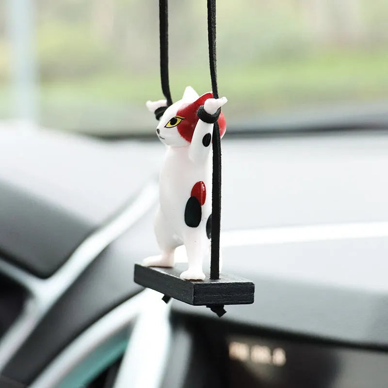 Resin cartoon cat pendant on a 25cm rope for car rear-view mirror decoration.