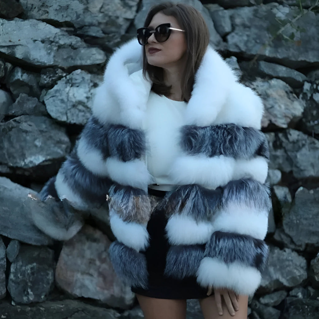 Loose-fitting women's hooded coat in artificial fur, shown in brown colour, with street fashion style.