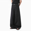 Black high waist straight leg jeans on a neutral background
