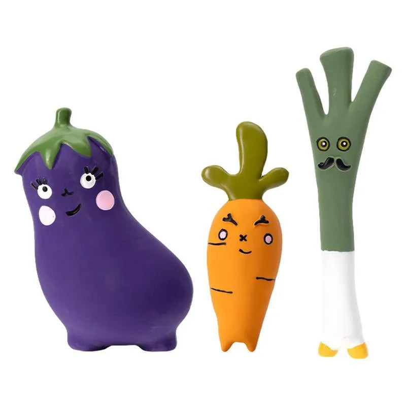 Green latex dog chew toy shaped like a cartoon onion, next to a purple eggplant-shaped chew toy.