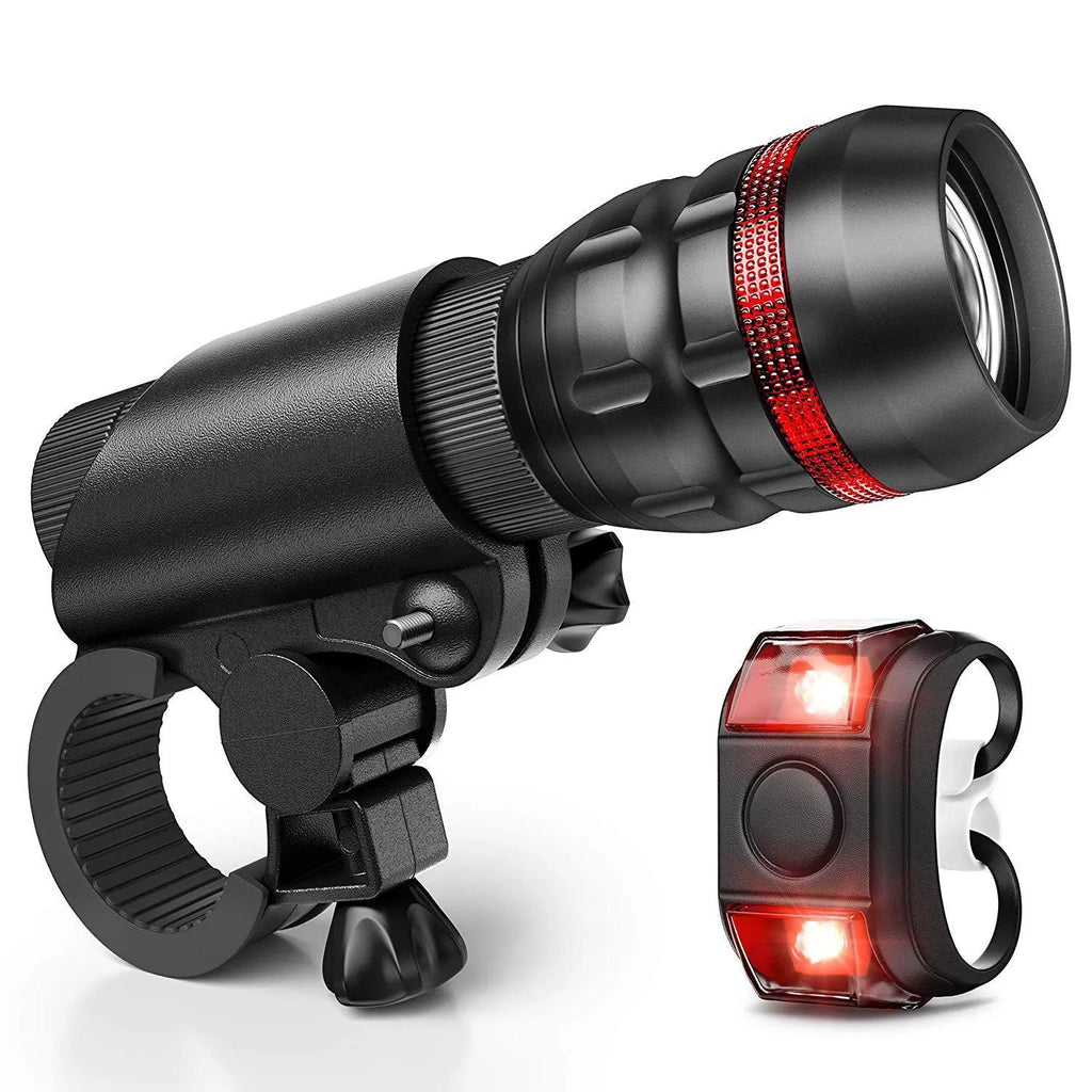 Bicycle headlight and taillight safety set with mounting bracket on a bike handlebar.