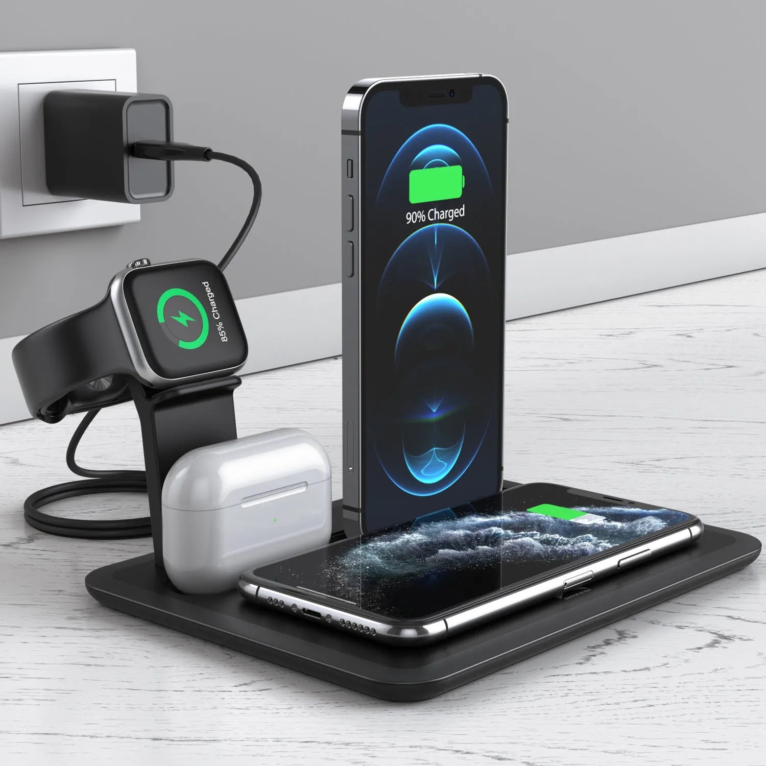 Black desktop wireless charging dock holding an iPhone, Apple Watch and AirPods case with cables connected.