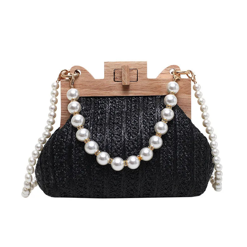 Beige straw woven women's shoulder bag with pearl chain strap showing front view